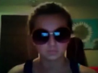 Naughty teen wearing sunglasses...