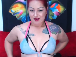 Redhead camgirl in three bras stripping