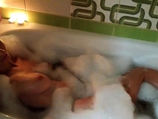 Amateur couple has romantic sex in the bathroom with candles