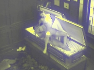 Couple sex on coffin...