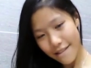 Amateur asian girl masturbates with dildo on cam