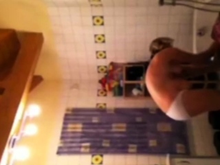 Spying on stepmom as she lotions her body